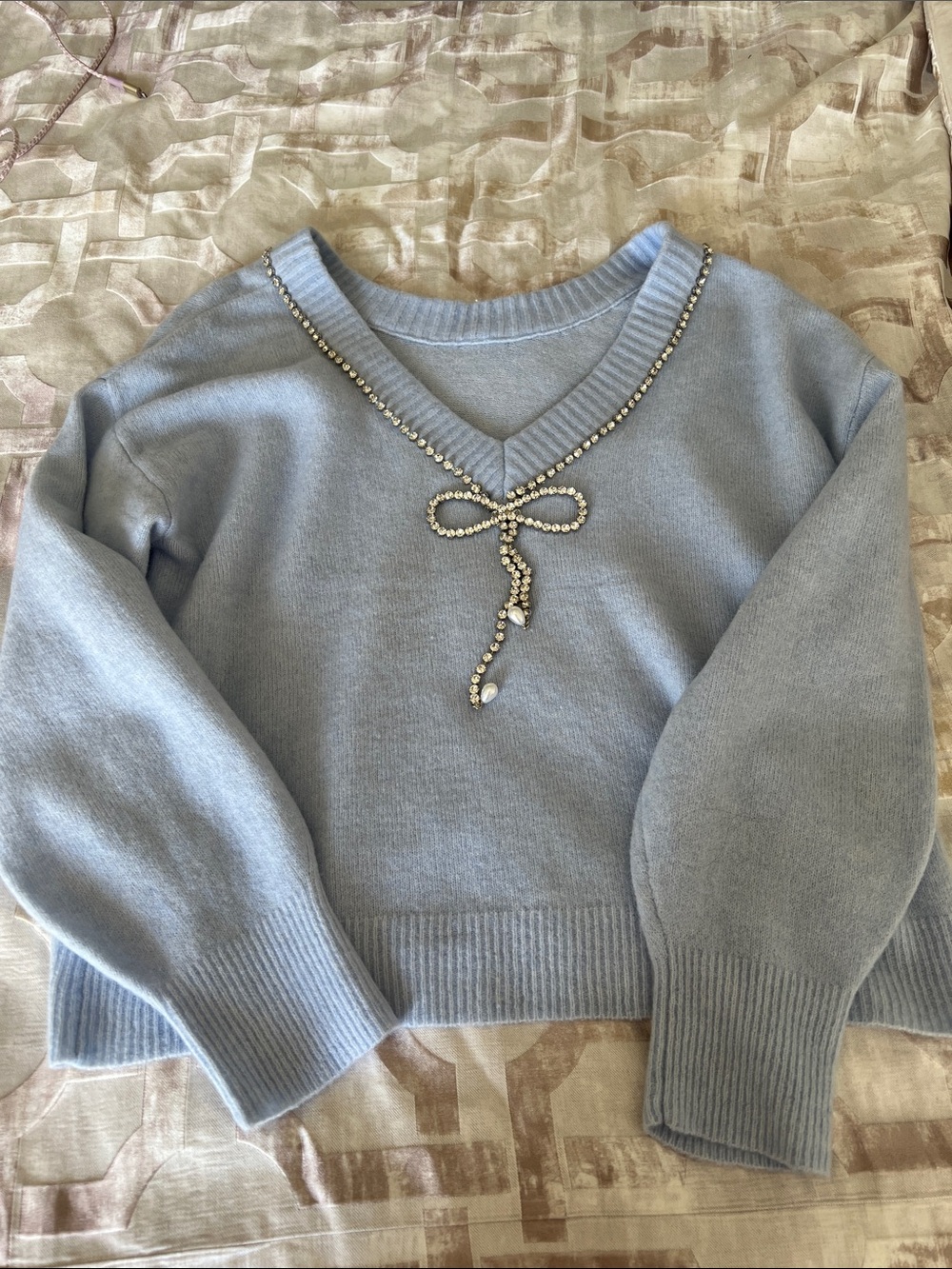 Express Light Blue V-Neck Sweater with Rhinestone Bow